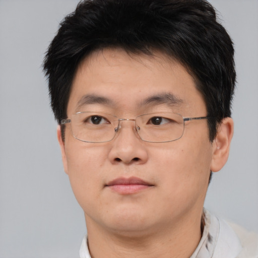Neutral asian adult male with short  brown hair and brown eyes
