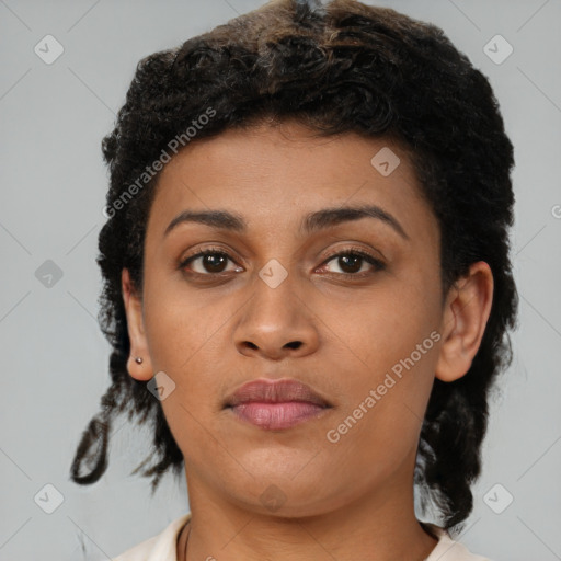 Joyful black young-adult female with short  brown hair and brown eyes