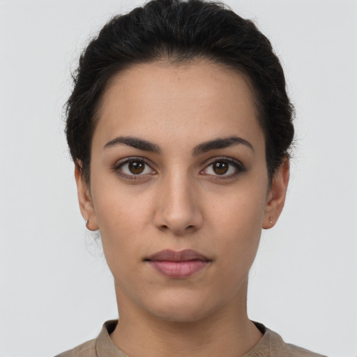 Neutral white young-adult female with short  brown hair and brown eyes