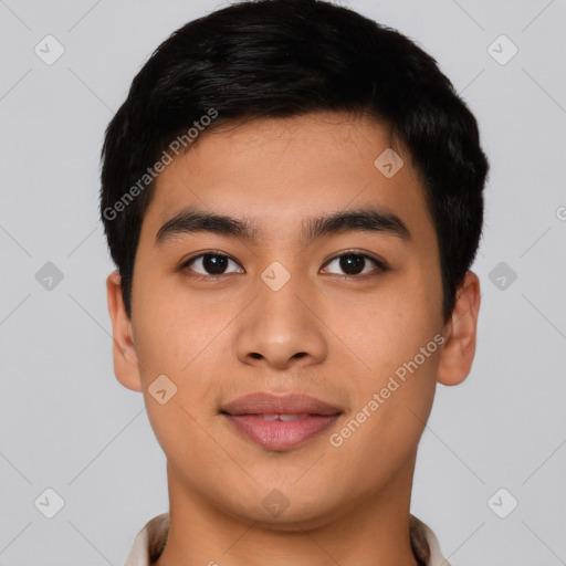 Joyful asian young-adult male with short  black hair and brown eyes