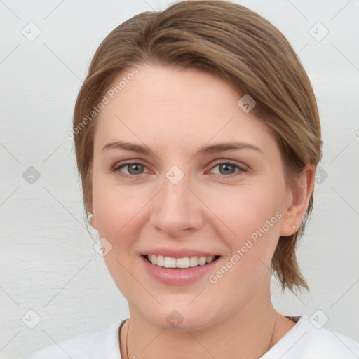 Joyful white young-adult female with medium  brown hair and grey eyes