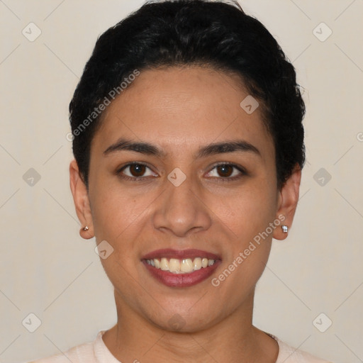 Joyful latino young-adult female with short  black hair and brown eyes