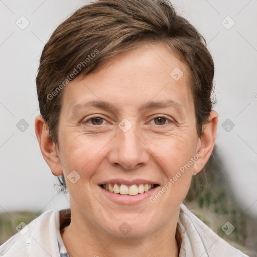 Joyful white adult female with short  brown hair and brown eyes