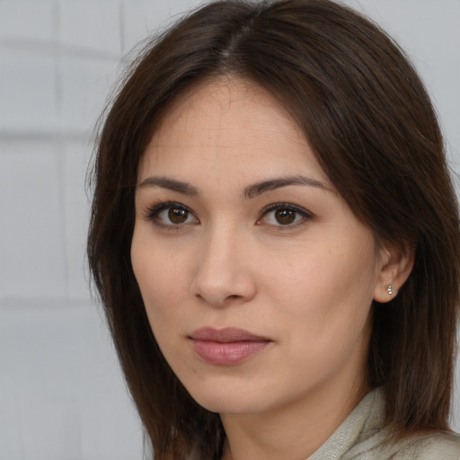 Neutral white young-adult female with long  brown hair and brown eyes