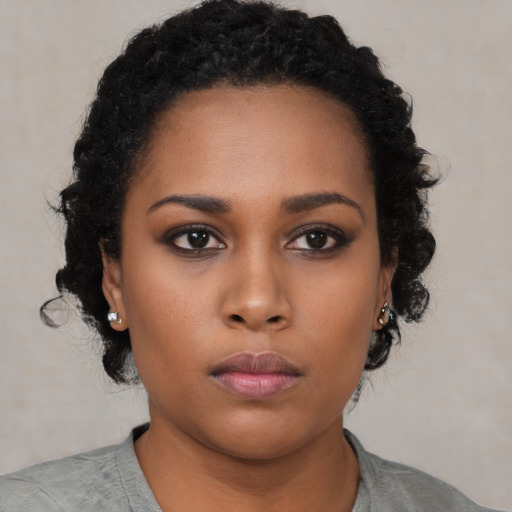 Neutral black young-adult female with short  black hair and brown eyes