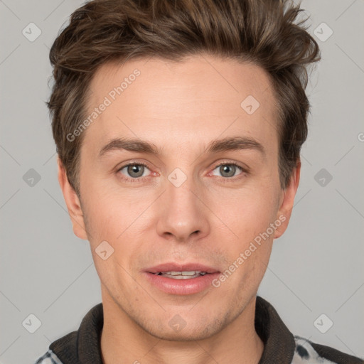 Joyful white adult male with short  brown hair and grey eyes