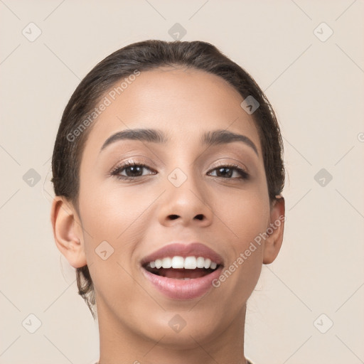 Joyful white young-adult female with short  brown hair and brown eyes