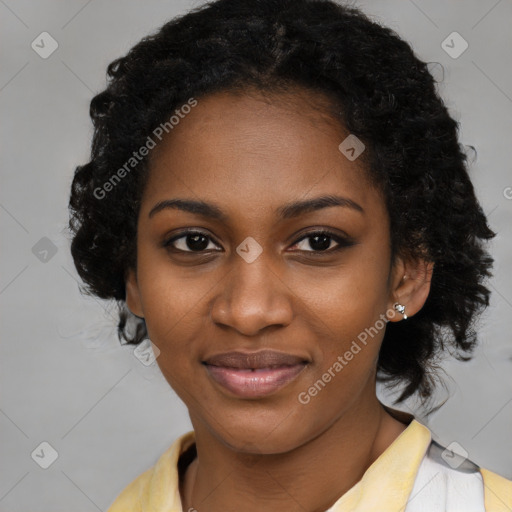 Joyful black young-adult female with long  black hair and brown eyes