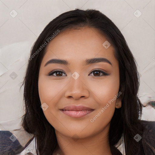 Joyful latino young-adult female with long  black hair and brown eyes