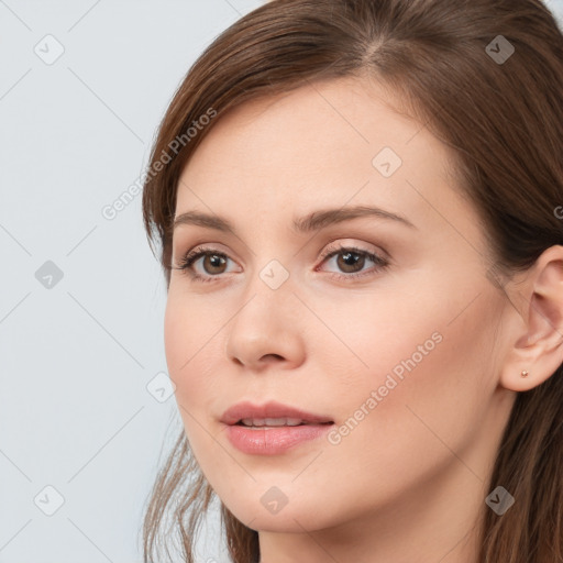 Neutral white young-adult female with long  brown hair and brown eyes