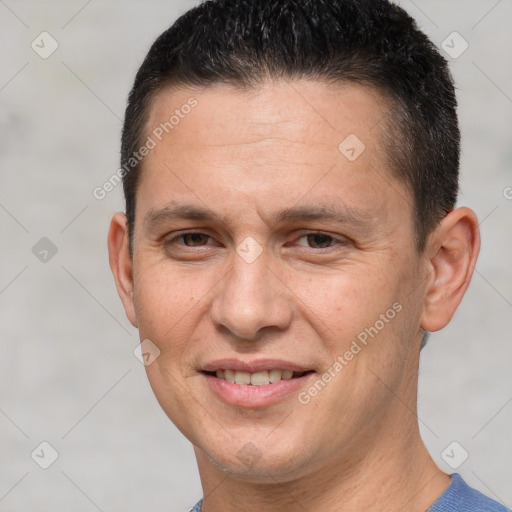 Joyful white adult male with short  brown hair and brown eyes