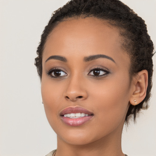 Joyful latino young-adult female with short  brown hair and brown eyes