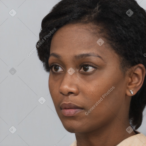 Neutral black young-adult female with short  black hair and brown eyes