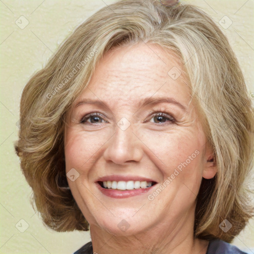 Joyful white adult female with medium  brown hair and blue eyes