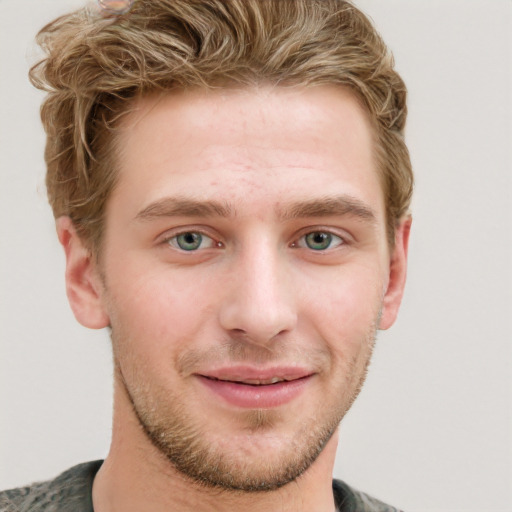 Joyful white young-adult male with short  brown hair and blue eyes