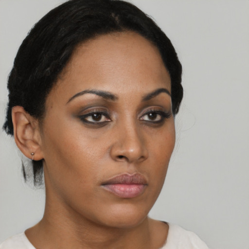 Neutral black young-adult female with short  brown hair and brown eyes