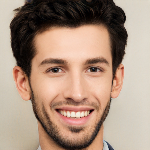 Joyful white young-adult male with short  black hair and brown eyes