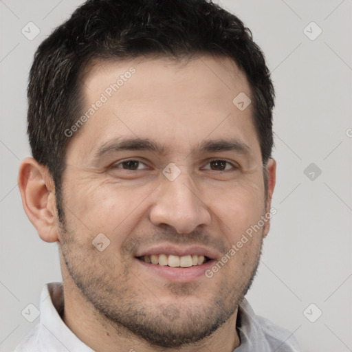 Joyful white adult male with short  brown hair and brown eyes