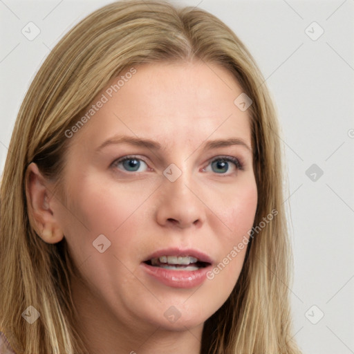 Joyful white young-adult female with long  brown hair and blue eyes