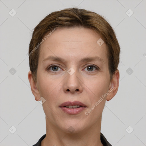 Joyful white young-adult female with short  brown hair and grey eyes