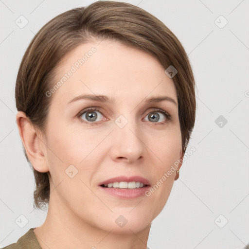 Joyful white young-adult female with short  brown hair and grey eyes