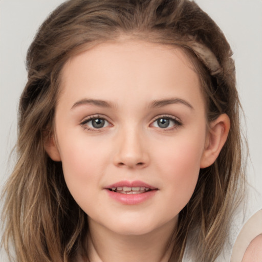 Joyful white child female with long  brown hair and brown eyes