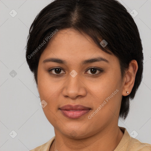 Joyful latino young-adult female with medium  brown hair and brown eyes