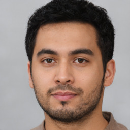 Neutral latino young-adult male with short  black hair and brown eyes