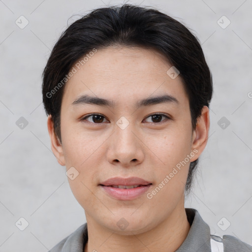 Joyful asian young-adult female with short  black hair and brown eyes