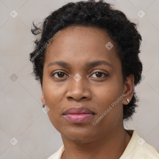 Joyful black adult female with short  brown hair and brown eyes