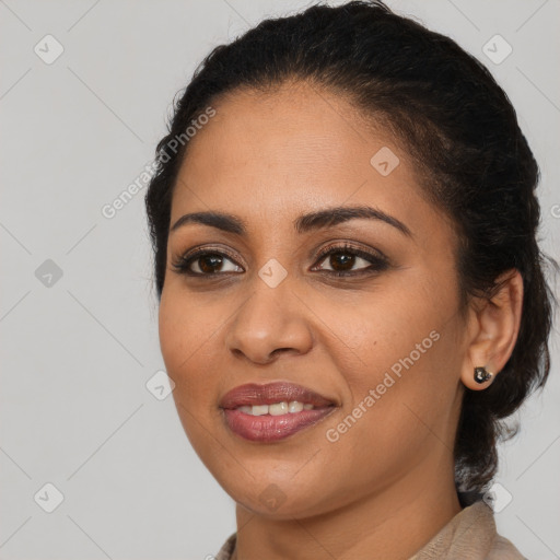 Joyful latino young-adult female with long  brown hair and brown eyes