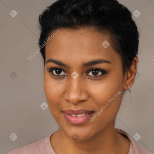 Joyful black young-adult female with short  black hair and brown eyes