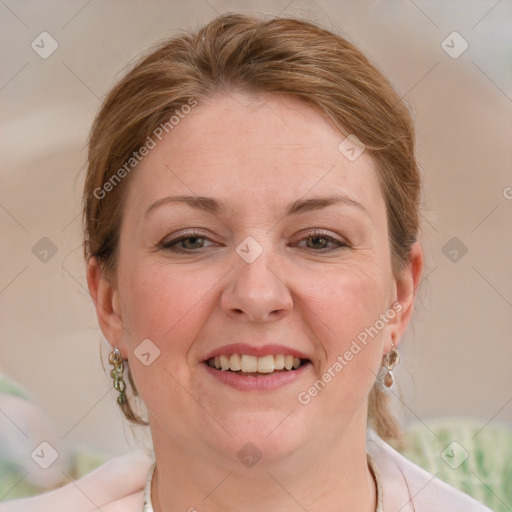 Joyful white adult female with medium  brown hair and blue eyes