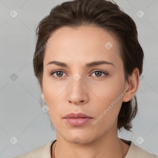 Neutral white young-adult female with medium  brown hair and brown eyes