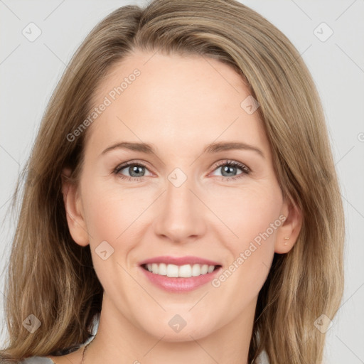 Joyful white young-adult female with long  brown hair and green eyes