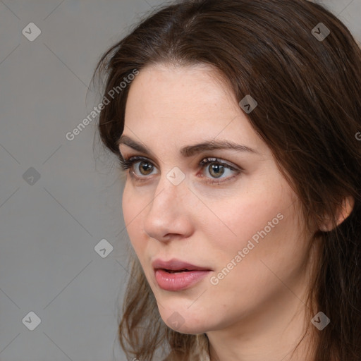 Neutral white young-adult female with long  brown hair and brown eyes