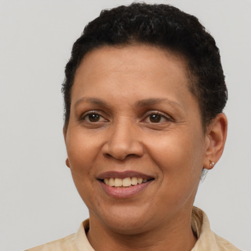 Joyful latino adult female with short  brown hair and brown eyes