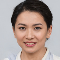 Joyful asian young-adult female with short  brown hair and brown eyes