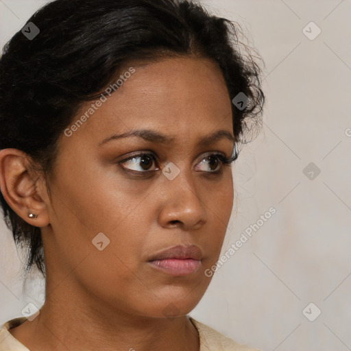 Neutral black young-adult female with medium  brown hair and brown eyes