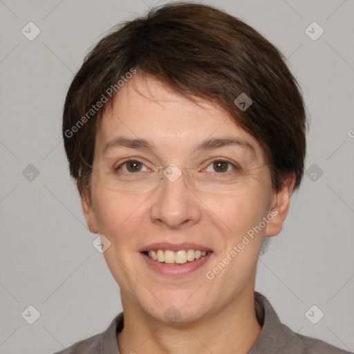 Joyful white adult female with short  brown hair and grey eyes