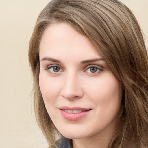 Joyful white young-adult female with medium  brown hair and green eyes