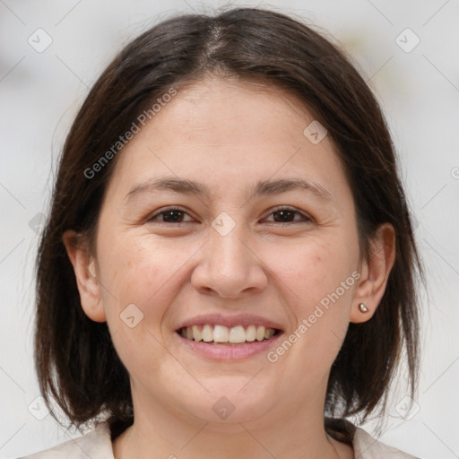 Joyful white adult female with medium  brown hair and brown eyes