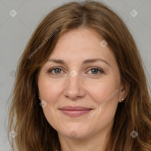 Joyful white adult female with long  brown hair and brown eyes