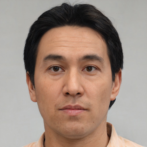 Neutral asian adult male with short  black hair and brown eyes