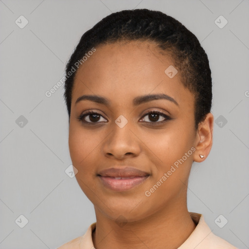 Joyful black young-adult female with short  black hair and brown eyes