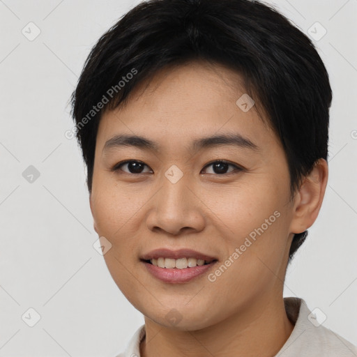 Joyful asian young-adult female with short  brown hair and brown eyes