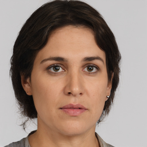 Neutral white young-adult female with medium  brown hair and brown eyes