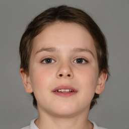 Joyful white child female with short  brown hair and brown eyes