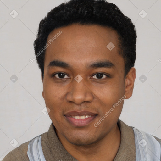 Joyful black young-adult male with short  black hair and brown eyes