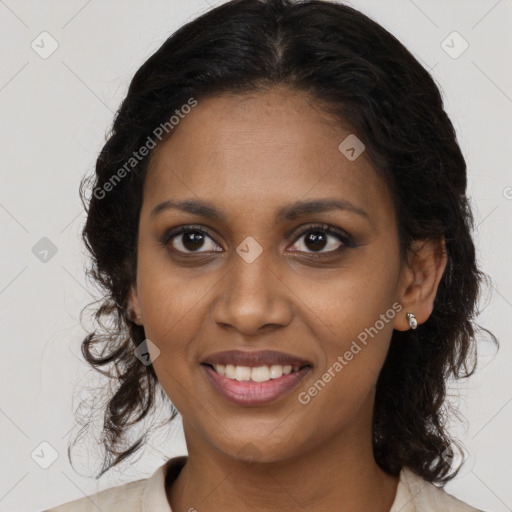 Joyful black young-adult female with long  brown hair and brown eyes